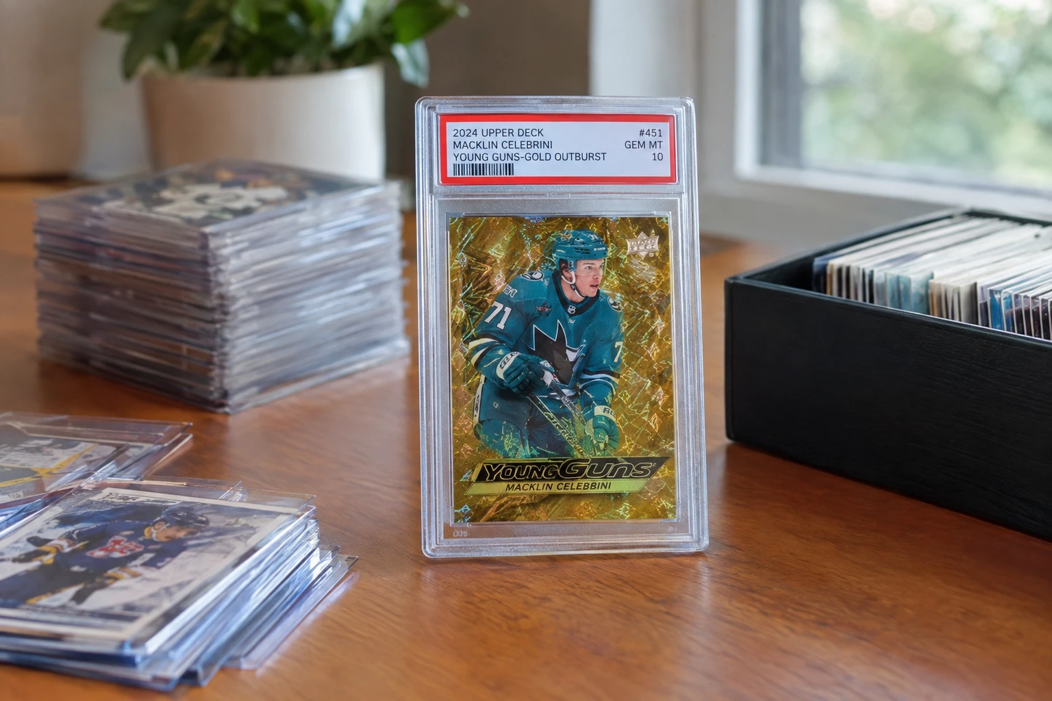 Macklin Celebrini Young Guns rookie card in PSA slab with record-breaking auction sale price overlay and hockey card collecting theme