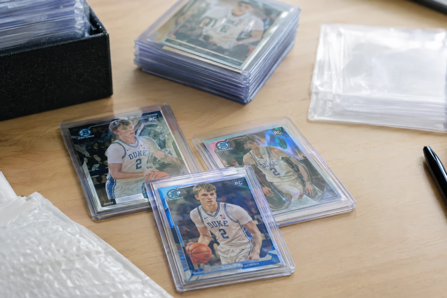 Cooper Flagg basketball cards including Topps Chrome and Bowman Chrome rookies being prepared for PSA grading submission