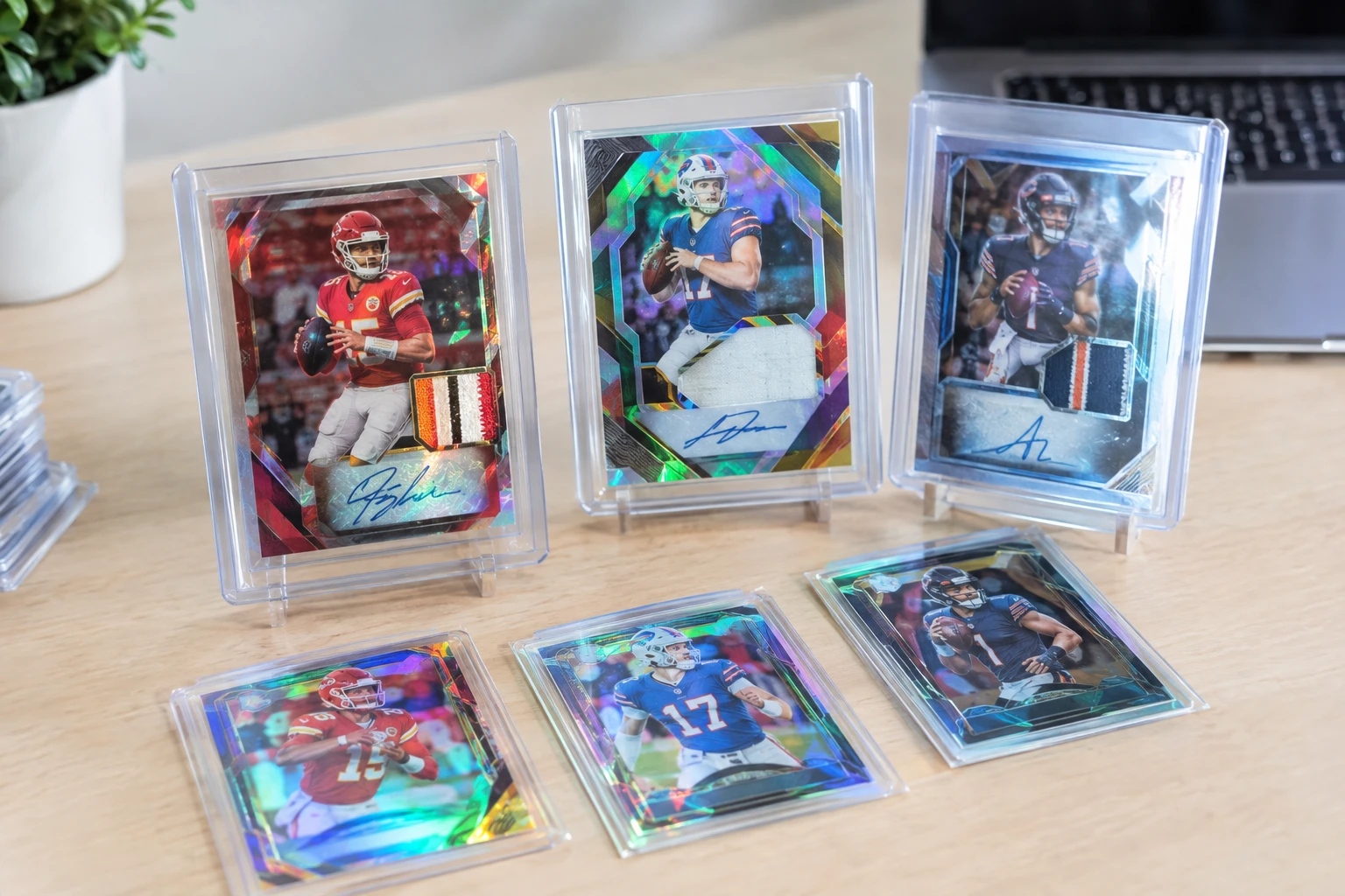 Football trading cards featuring Patrick Mahomes, Josh Allen, and Caleb Williams Prizm and RPA cards laid out for AI grading analysis
