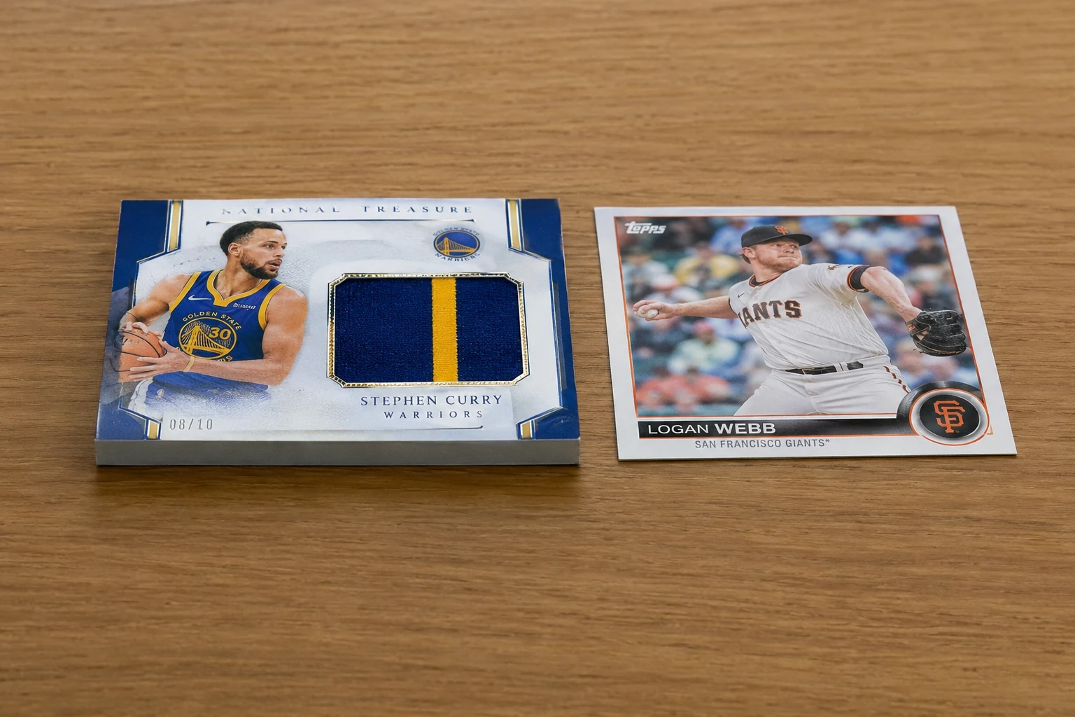 A thick memorabilia trading card with a fabric swatch being graded