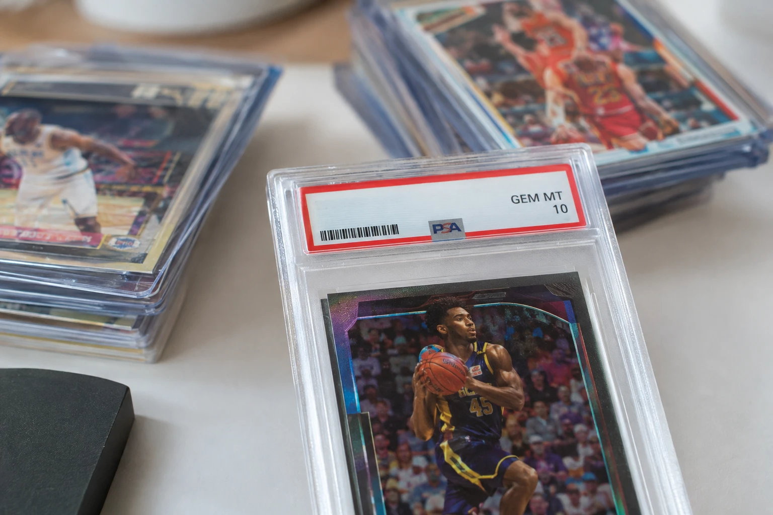 Close-up of a PSA Gem Mint 10 label on a graded trading card slab