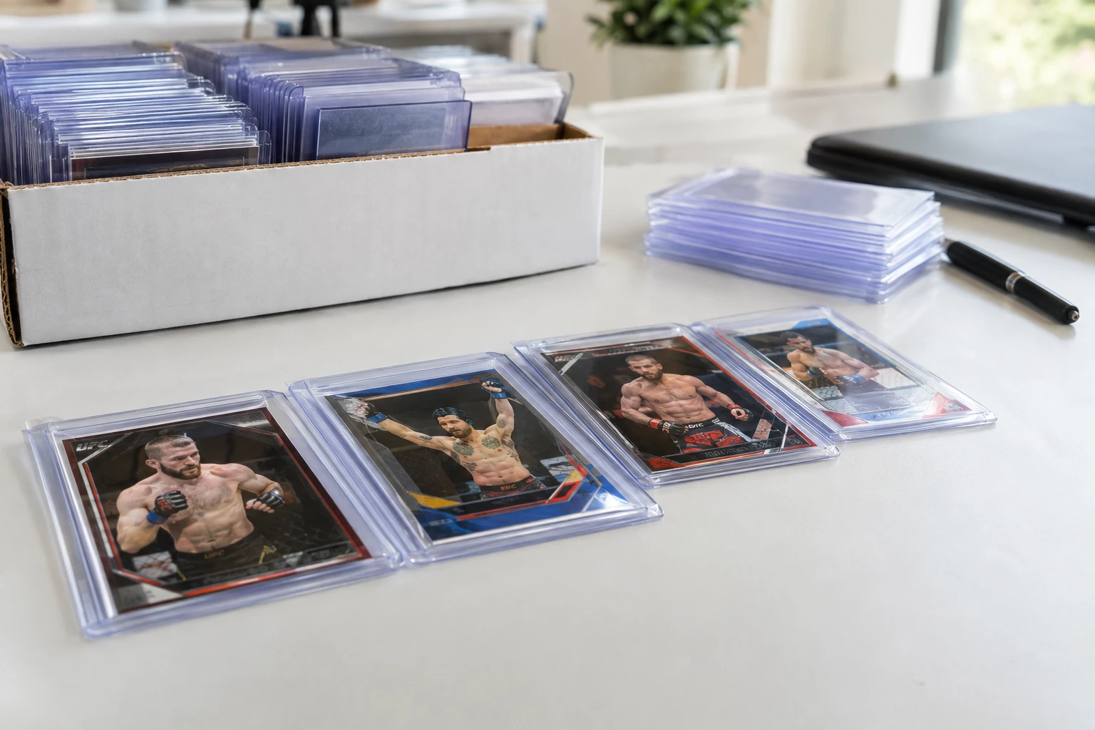 UFC trading cards featuring top MMA fighters being prepared for PSA grading submission